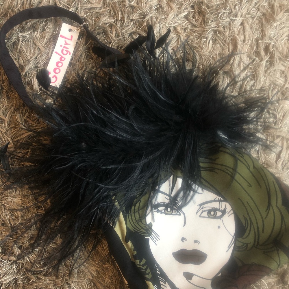 Handmade fabric purse with feathers